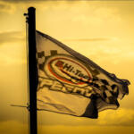 Sun sets behind the Toowoomba speedway flag